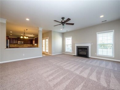 Huge family room with brand new carpet, gas log fi