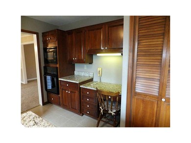 Kitchen. Planning desk and stacked microwave and o