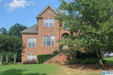 Stately facade- all brick with mature landscaping.