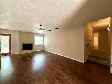 Unfurnished living room featuring a ceiling fan, 