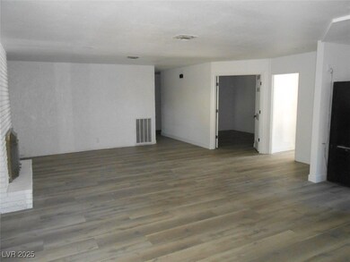 Unfurnished room with wood finished floors