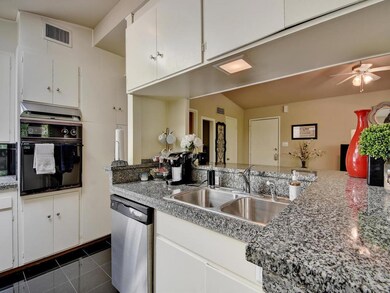 Kitchen featuring stainless steel dishwasher, ove