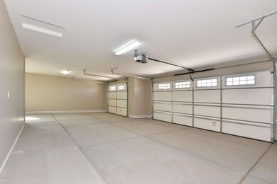 Large 4 car garage with 1/2 bath and