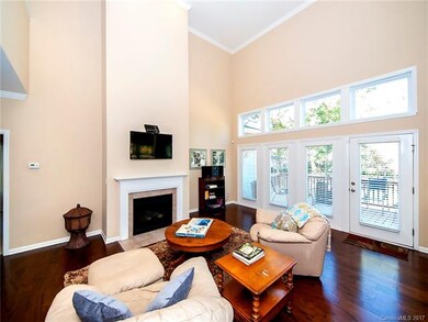 Part of the inviting great room with gas fireplace and more wood flooring!