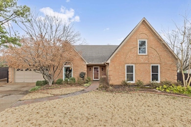 View of front of property featuring concrete drive