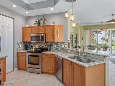 Kitchen with a peninsula, stainless steel applianc