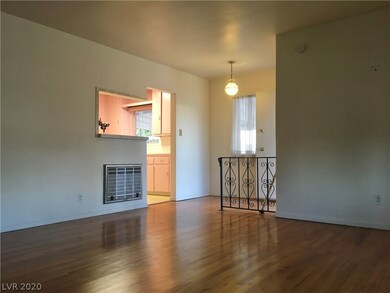 14x15 Living Room with original hardwood floors. A