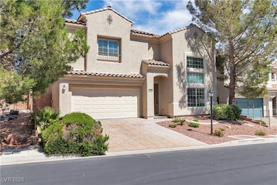 Mediterranean / spanish-style house featuring an attached garage, a tile roof, decorative driveway, and stucco siding