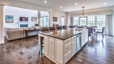 Open to the kitchen is the impressive family room.