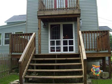 Exterior Back. CLOSE UP OF DOORS,  FENCED YARD TO 