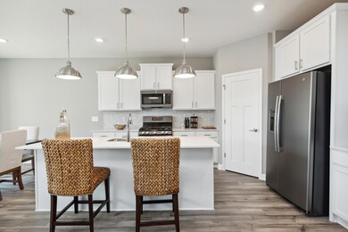 Look at all of that abinet space! Large walk in pantry tucked in the corner!