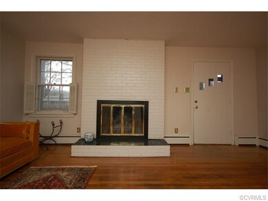 The wood burning fireplace anchors the living room
