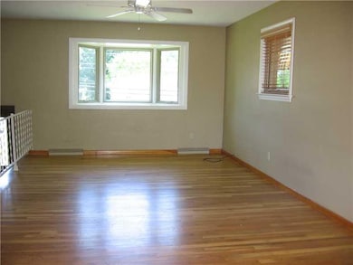 Living Room. The floor and neutral hue of the livi