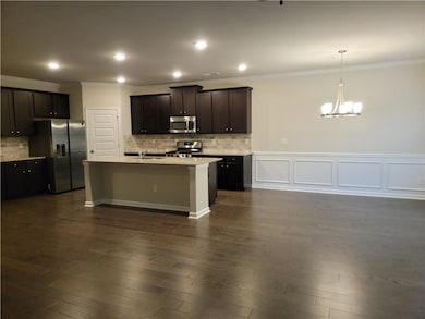 Kitchen featuring a notable chandelier, light coun