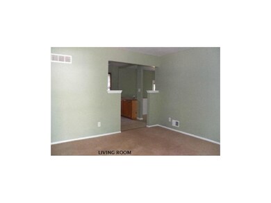 VIEW LOOKING FROM FRONT DOOR, IN LIVING ROOM STRAI
