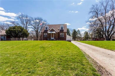 House sits off the road.