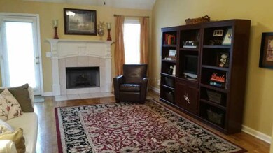 Living Room Features Hardwood Floors and a Fireplace!
