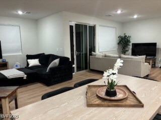 Living area with light wood finished floors and re