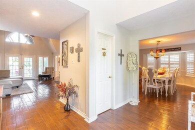 View of formal dining and family room from foyer.