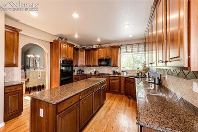 Spacious kitchen with granite countertops & center