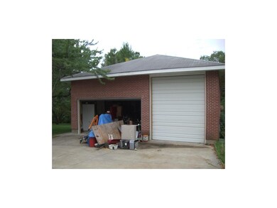 detached outbuilding, can hold 6 cars