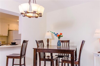 Formal dining room and bar area leading into kitch