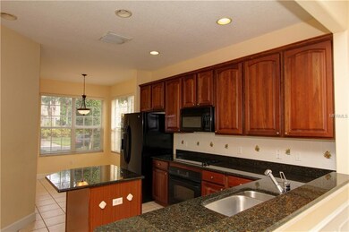 Kitchen featuring food prep island with glass cook
