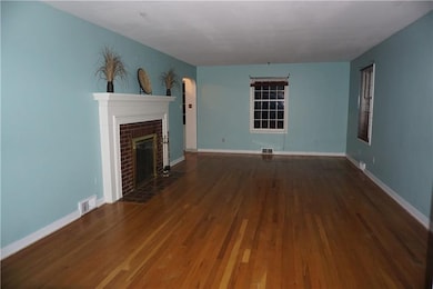 Gleaming Hardwood Floors with Fireplace