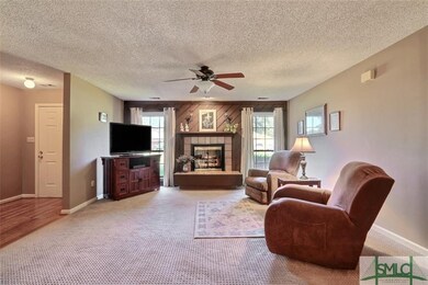 Living room with wood burning fireplace
