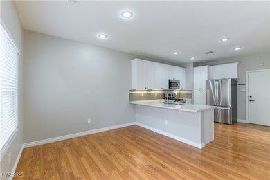 Kitchen with appliances with stainless steel finis