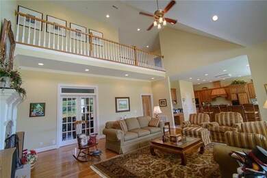 Vaulted ceiling with picture window to right and two doors to the back deck not shown.