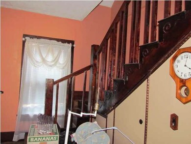 staircase leads up to a storage room