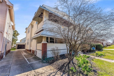 View of side of home featuring a garage