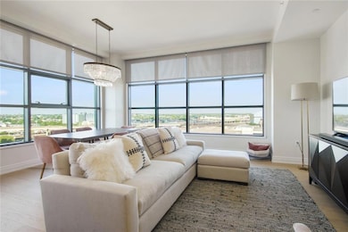 Expansive iron-framed windows that bathe every roo