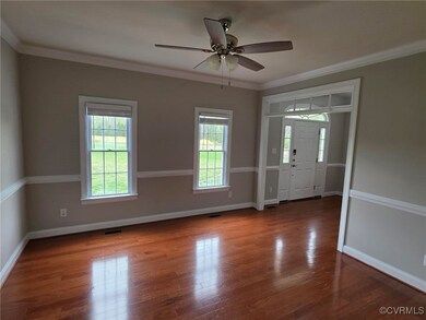 Entryway with wood finished floors, ornamental mol