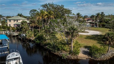 Property view of water with a boat dock