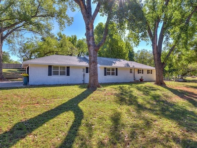 Single story home featuring brick siding