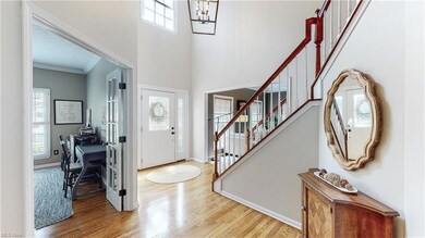 Entry way foyer with gleaming hardwood floors