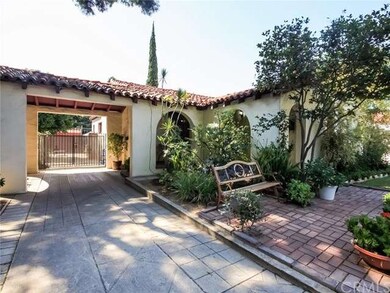 Cozy front porch and front yard sitting grace this