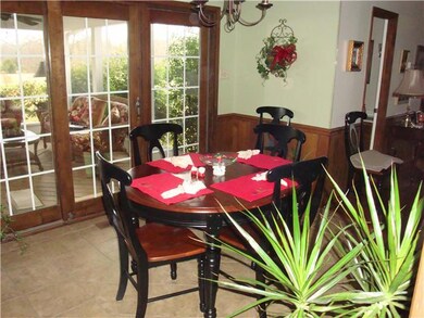 The Less Formal Dining Area is off of the Kitchen next to the Really Nice Sliding Doors that Lead to the Screened in Back Porch.
