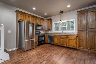Large eat-in kitchen has stainless appliances.