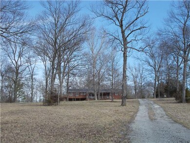 In town but private, acreage, shop, all brick!