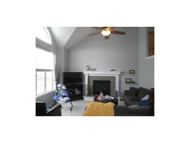 Living room w/gas fireplace and ceiling fan