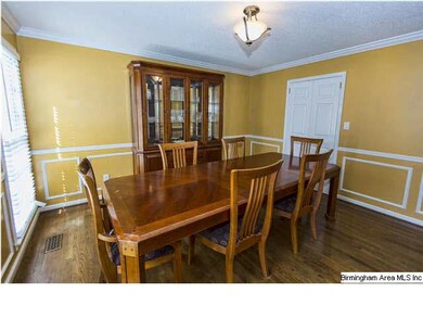 Detailed Chair railing in spacious dining room.  T