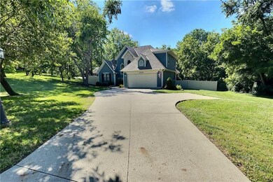 Abundant parking on lengthy driveway to entrance o