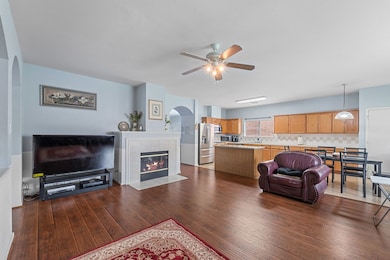 Spacious open-concept living area with hardwood fl