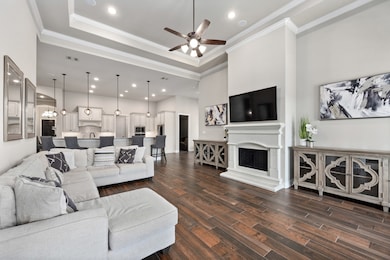 The family room features a cast stone fireplace an