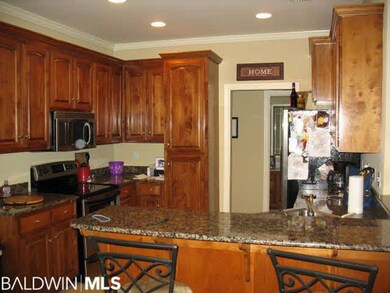 Kitchen with granite counter tops and stainless st