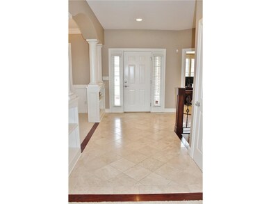 Foyer with travertine tile