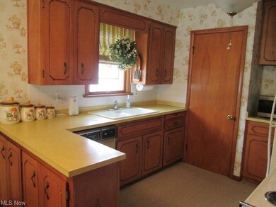 Kitchen has plenty of counter space and cabinets